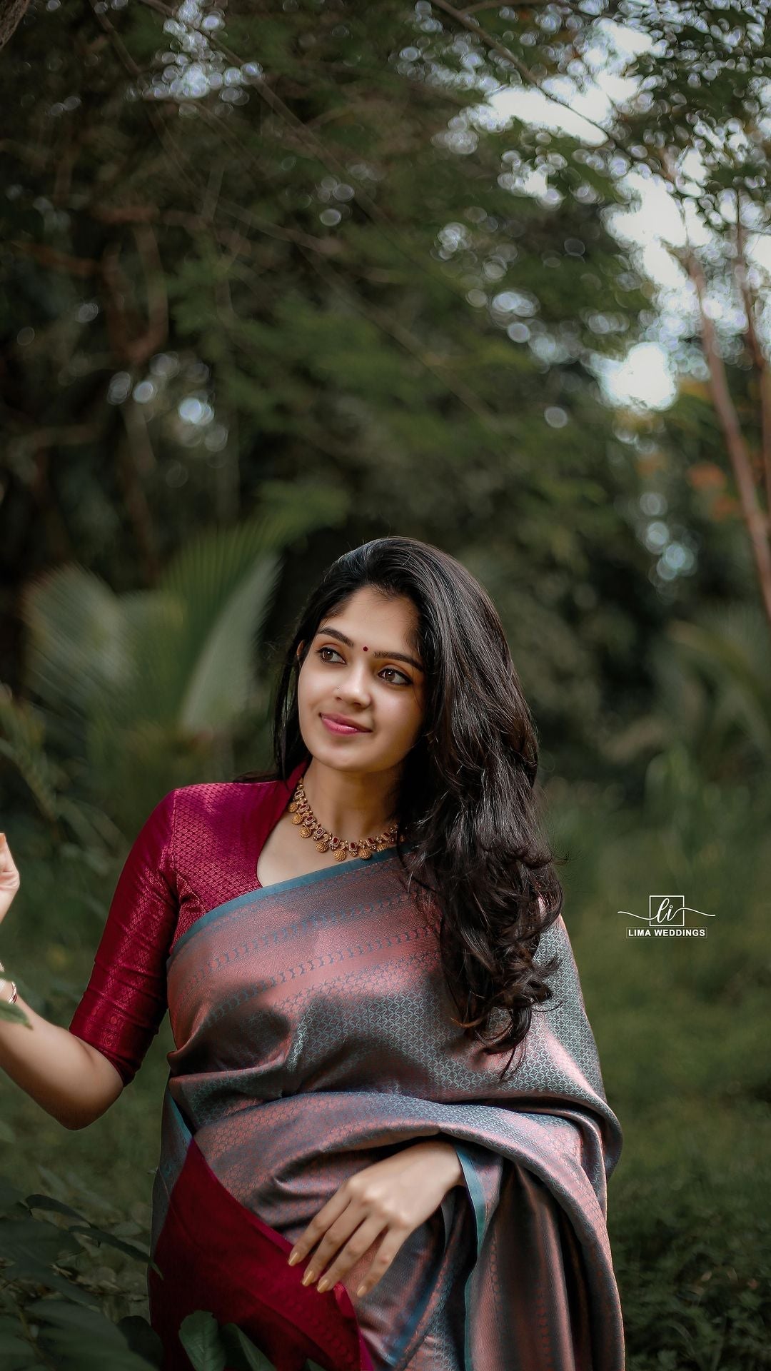 Image of Indian traditional Beautiful Woman Wearing an traditional Saree  And Posing On The Outdoor With a Smile Face-SU974373-Picxy